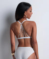Model wearing 'Vibes' White Triangle Bralette, by Aubade (back view).