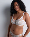 Model wearing 'Vibes' Pearl White Shoulder Full Cup Bra, by Aubade (front view).