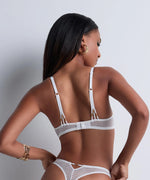 Model wearing 'Vibes' White Tanga, by Aubade (back view).