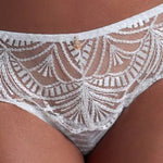 Model wearing 'Vibes' White Italian Brief, by Aubade (front view, detail).