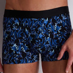 Model wearing 'Blue Flower' Men's Boxer Short, by Aubade (front view, close up detail).
