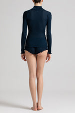 Model wearing 'Bella' Navy Blue Wool and Silk Turtleneck, by Boglietti (back view).