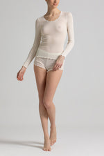 Model wearing 'Basilia' Cream Long-Sleeved Tank Topny Boglietti (front view).