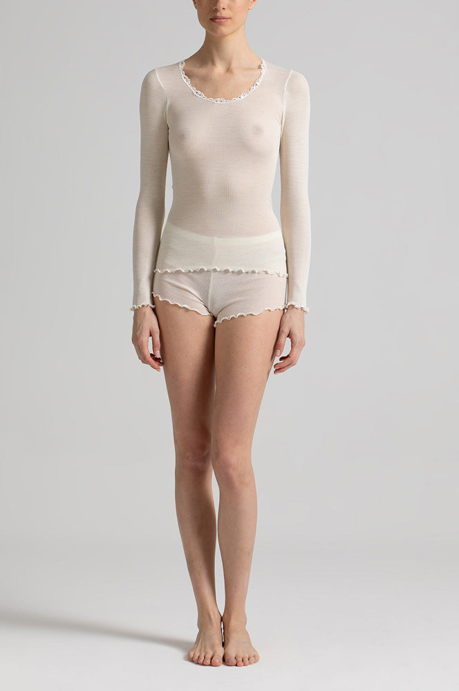 Model wearing 'Basilia' Cream Long-Sleeved Tank Topny Boglietti (front view).