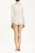 Model wearing 'Orosei' Ivory Long-Sleeved Tank Top, by Boglietti (back view).