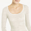 Model wearing 'Orosei' Ivory Long-Sleeved Tank Top, by Boglietti (front view, close up).