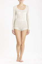 Model wearing 'Orosei' Ivory Long-Sleeved Tank Top, by Boglietti (front view).