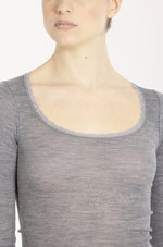 Model wearing 'Orosei' Light Grey Long-Sleeved Top, by Boglietti (front view, close up).
