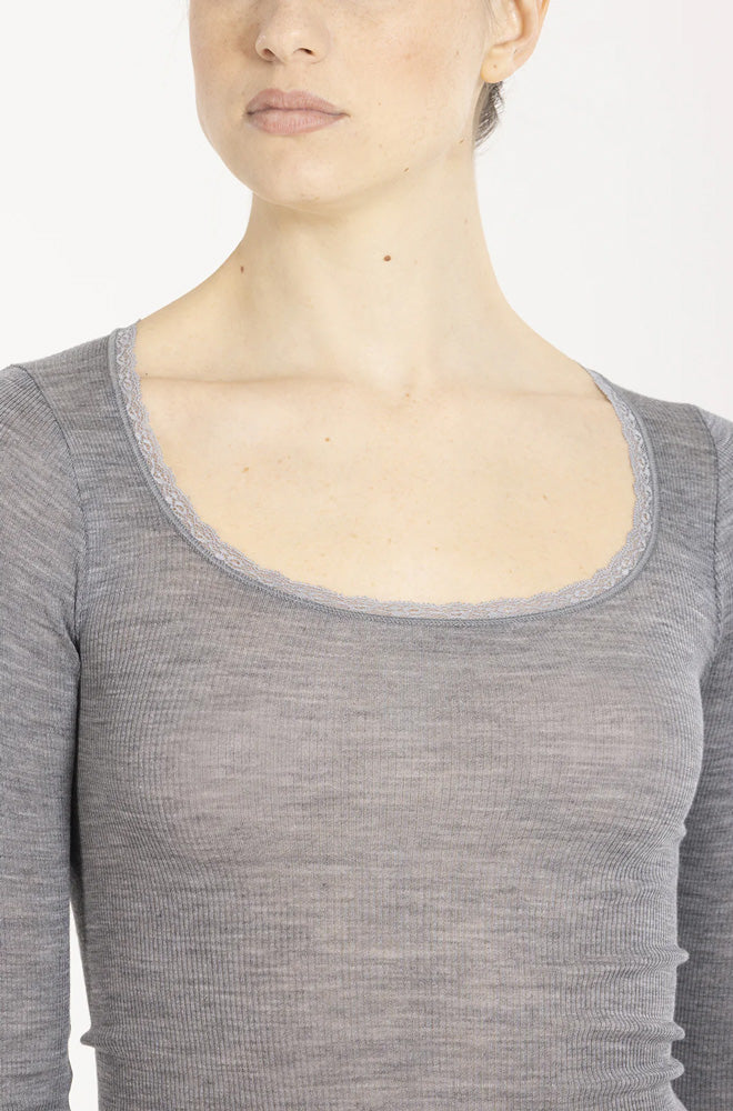Model wearing 'Orosei' Light Grey Long-Sleeved Top, by Boglietti (front view, close up).