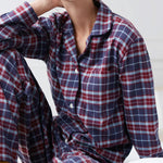 Model wearing Women's Brushed Cotton Arran Tartan Pyjama Set, by British Boxers (close-up).