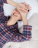 Model wearing Women's Brushed Cotton Arran Tartan Pyjama Set, by British Boxers (close-up).