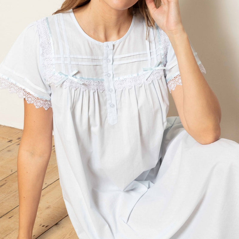 Model wearing 'Cara' Victorian Cotton Lawn Short Sleeve Nightdress in Pale Blue, by Cottonreal.