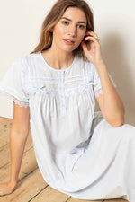Model wearing 'Cara' Victorian Cotton Lawn Short Sleeve Nightdress in Pale Blue, by Cottonreal.
