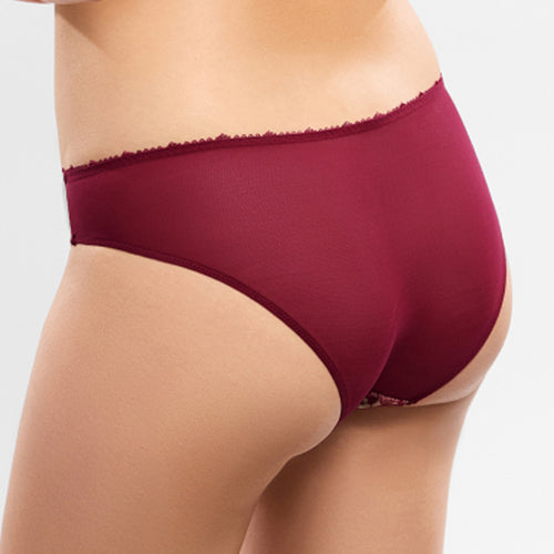 Model wearing 'Agathe' Amarante (Burgundy) Brief, by Empreinte (back view, close up).