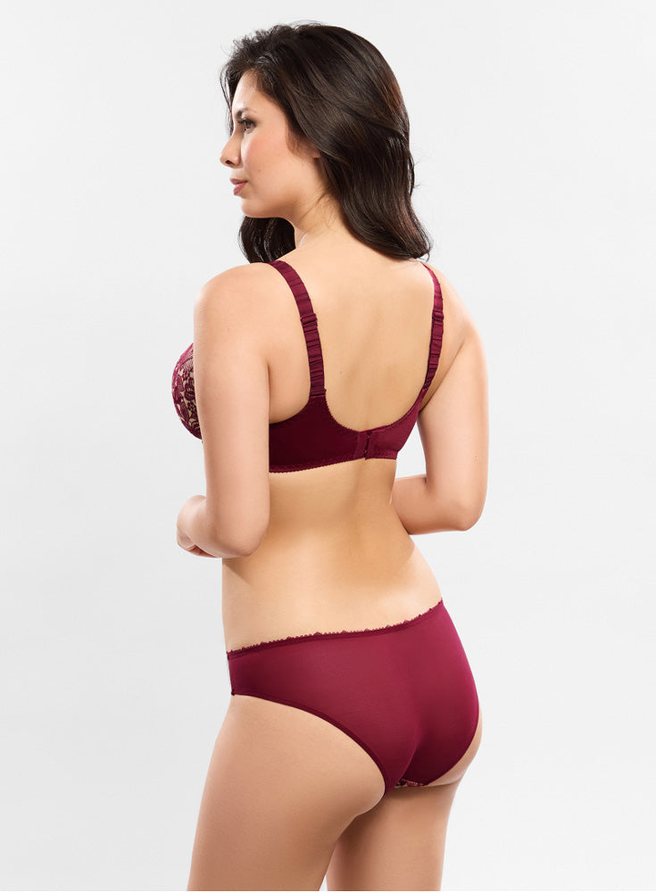 Model wearing 'Agathe' Amarante (Burgundy) Brief, by Empreinte (back view).