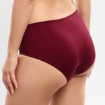 Model wearing 'Agathe' Amarante (Burgundy) Panty, by Empreinte (side view, close up).