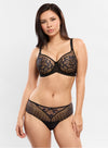 Model wearing 'Amour' Black Thong, by Empreinte (front view.