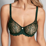 Model wearing 'Cassiopee' Seamless Bra in Emerald, by Empreinte.