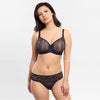 Model wearing 'Cassiopée' Navy Seamless Full Cup Bra, by Empreinte (front view).