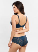 Model wearing 'Leia' Blue Invisible Full Cup Bra, by Empreinte (back view).