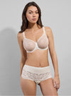 Model wearing 'Leia' Pale Cream Panty, by Empreinte (front view).