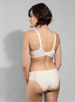 Model wearing 'Leia' Cream Invisible Full Cup Bra, by Empreinte (back view).