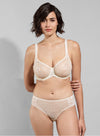 Model wearing 'Leia' Cream Invisible Full Cup Bra, by Empreinte (front view).