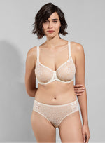 Model wearing 'Leia' Cream Invisible Full Cup Bra, by Empreinte (front view).