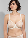 Model wearing 'Leia' Cream Invisible Full Cup Bra, by Empreinte (front view).