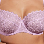 Model wearing Empreinte 'Romy' Lilac Low-Necked Half Cup Bra (detail).