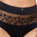 Model wearing 'Tess' Panty in Black, by Empreinte (front view, close-up).