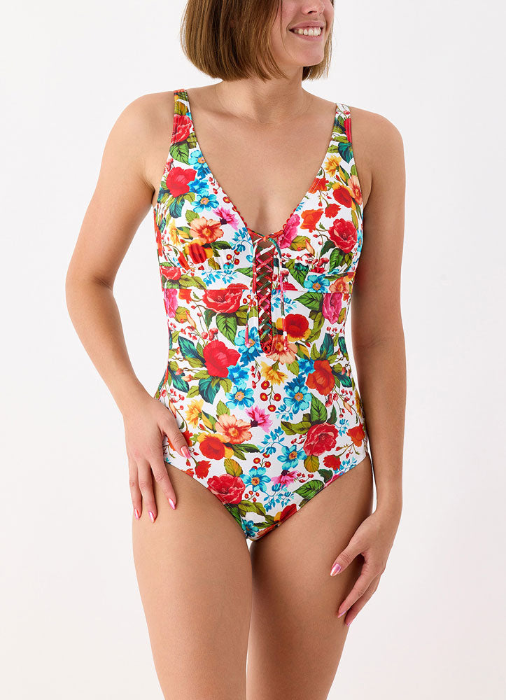 Model wearing 'Donatella' Multicoloured V-Neck Swimsuit, by Janine Robin (front view).