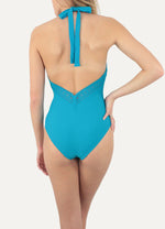 Model wearing Janine Robin 'Darling' Turquoise Blue Halterneck Swimsuit (back view).