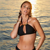 Model wearing 'Pure Elegance' Black Halterneck Triangle Bikini Top, by Lise Charmel (front view).