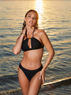 Model wearing 'Pure Elegance' Black Halterneck Triangle Bikini Top, by Lise Charmel (front view).
