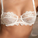 Model wearing 'Bellissime Amour' Ivory Half Cup Bra, by Lise Charmel (front view, close-up).