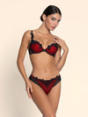 Model wearing 'Belissime Inconnue' Red and Black Contour Bra, by Lise Charmel (front view).