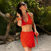 Model wearing 'Ajourage Couture' Orange Pareo/Wrap Skirt, by Lise Charmel (front view).