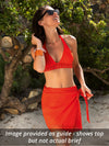 Model wearing Lise Charmel 'Ajourage Couture' Orange Halterneck Bikini top.