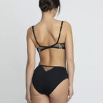 Model wearing 'Deesse en Glam' High Waisted Brief in black and gold by Lise Charmel (rear view).