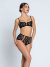 Model wearing 'Desirs de Venise' Vertical Seam Half Cup Bra, by Lise Charmel (front view).