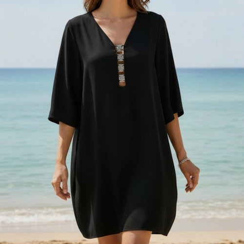 Model wearing 'Eclat D’Argent' Black Beach Tunic, by Lise Charmel (front view, close up).