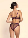 Model wearing 'Élégance Artist' Plum Purple Italian Brief, by Lise Charmel (back view).