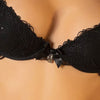 Model wearing Lise Charmel 'Soir de Venise' Black Padded Plunge Bra (detail).