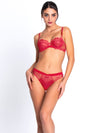 Model wearing 'Source Beauté' Thong in Hibiscus Beauté (Coral), by Lise Charmel.