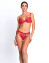 Model wearing 'Source Beauté' Italian Brief in Hibiscus Beauté (Coral), by Lise Charmel.