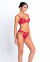 Model wearing 'Source Beauté' Italian Brief in Hibiscus Beauté (Coral), by Lise Charmel.