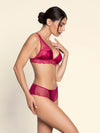 Model wearing 'Splendeur Soie' Raspberry Pink Silk Shorty, by Lise Charmel (side view).
