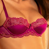 Model wearing 'Splendeur Soie' Raspberry Pink Silk Half Cup Bra, by Lise Charmel (front view, close up).