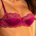 Model wearing 'Splendeur Soie' Raspberry Pink Silk Half Cup Bra, by Lise Charmel (front view, close up).